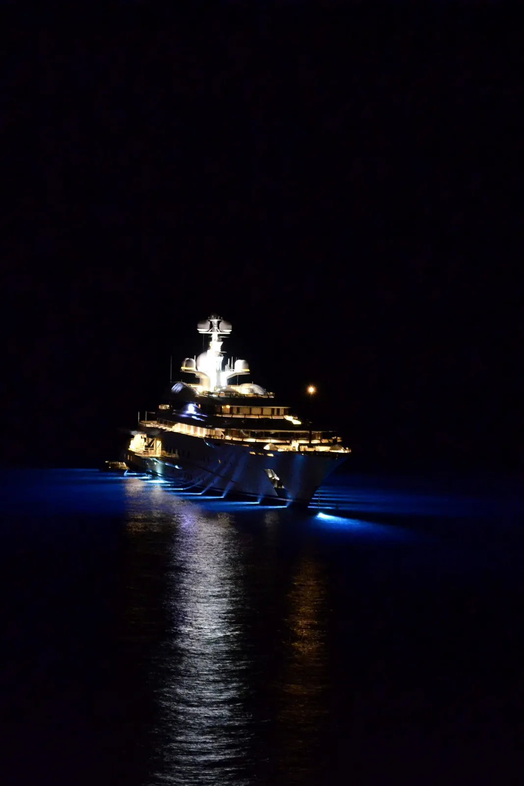 Superyacht at anchor at night